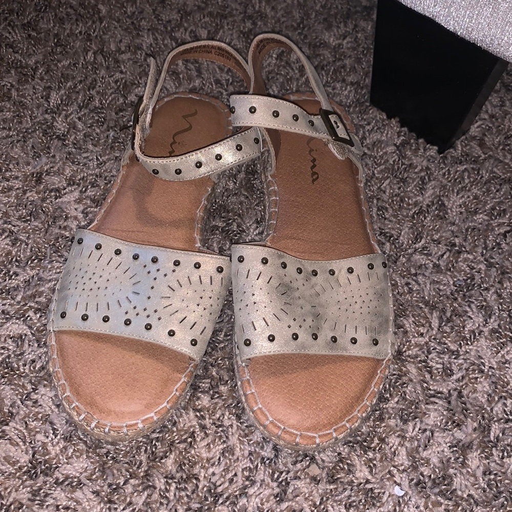 Gently worn gold sandals by Mina